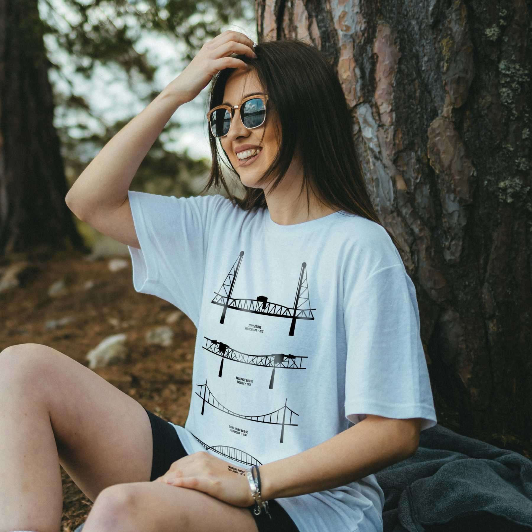 Rose City Roots Portland graphic tee — white on black worn by model in sunglasses